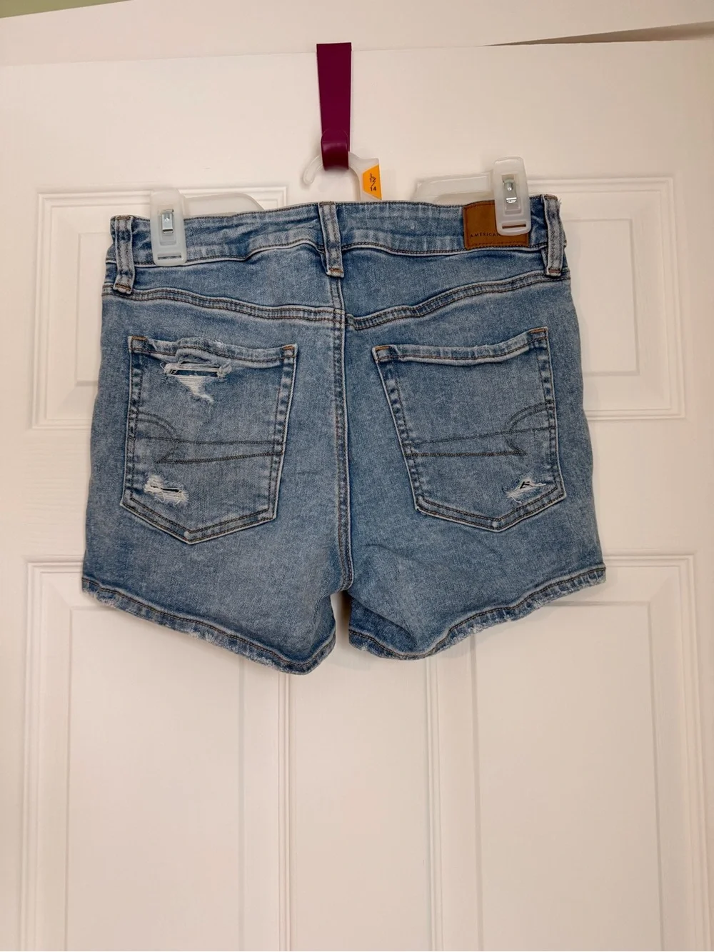 American Eagle Outfitters Women’s Light Blue Distressed Denim Midi Shorts
